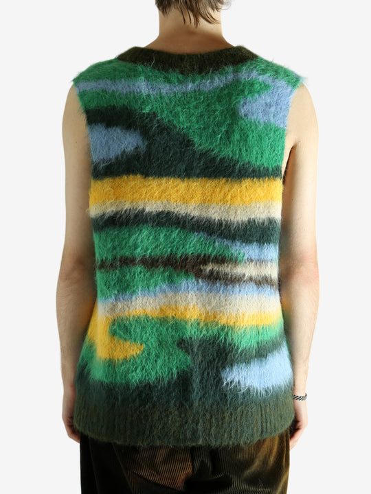 Green vest worn by a person, showing the vest's fit