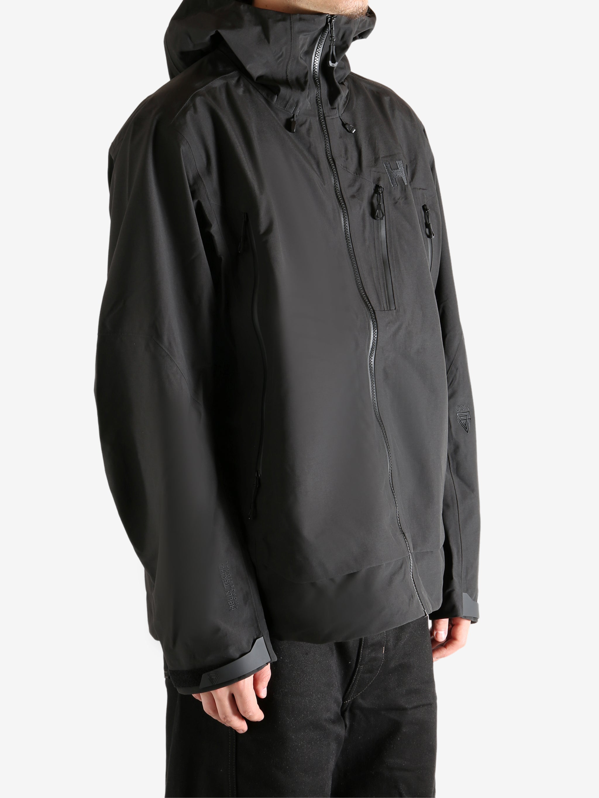 Black jacket worn by person, showing the jacket's fit