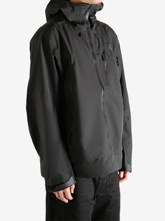 Black jacket worn by person, showing the jacket's fit