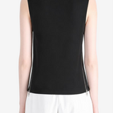 Black top worn by a person, showing the top fit