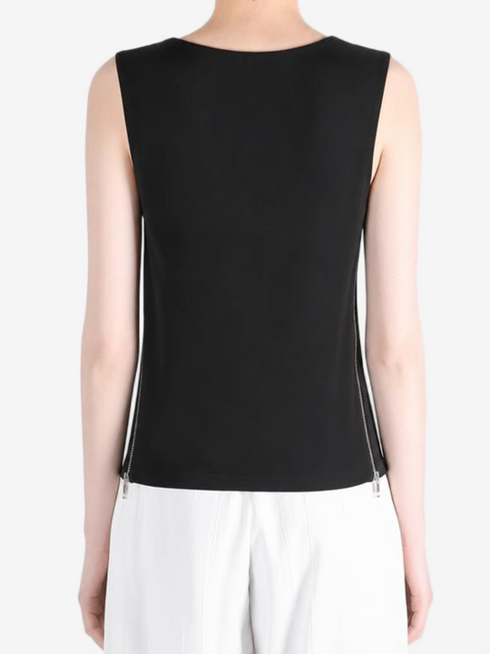 Black top worn by a person, showing the top fit