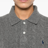 Close up of the grey knitwear, showing texture of the wool fabric