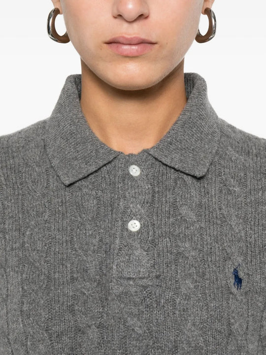Close up of the grey knitwear, showing texture of the wool fabric