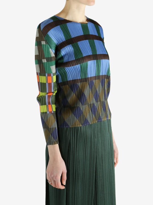 Blue top worn by a person, showing the top's fit