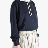 Navy parka worn by a person, showing the parka's fit