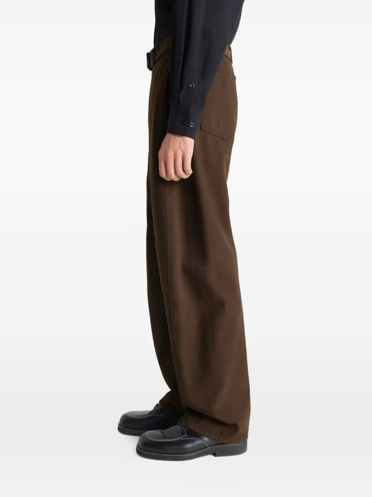 Brown pants worn by a person, showing the pants fit