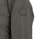 Grey jacket worn by a person, showing the jacket fit