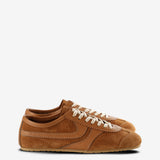 Tan sneakers, front view