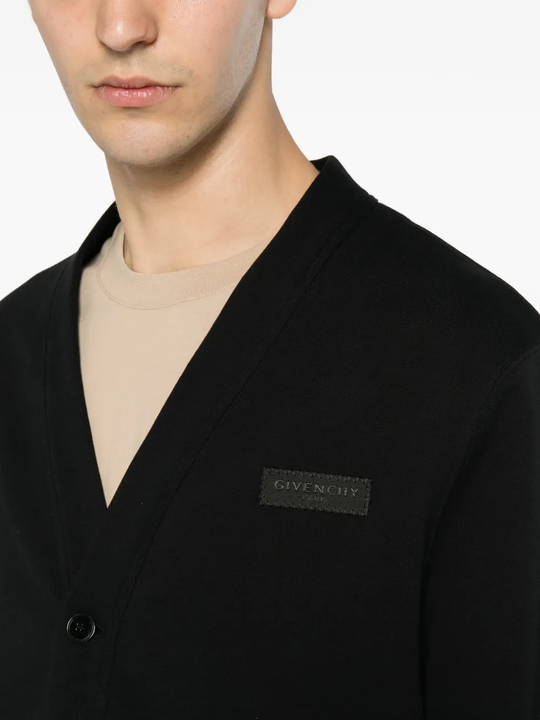 Close up of the black knitwear, showing texture of the cotton