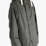 Grey jacket worn by a person, showing the jacket's fit