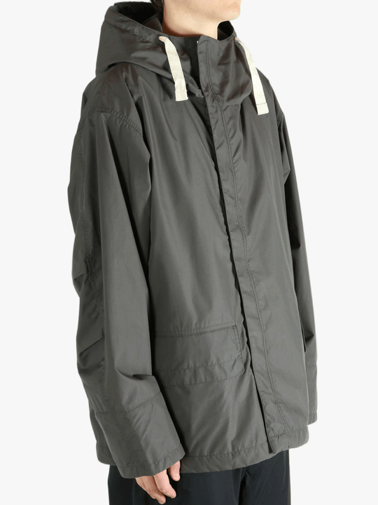 Grey jacket worn by a person, showing the jacket's fit