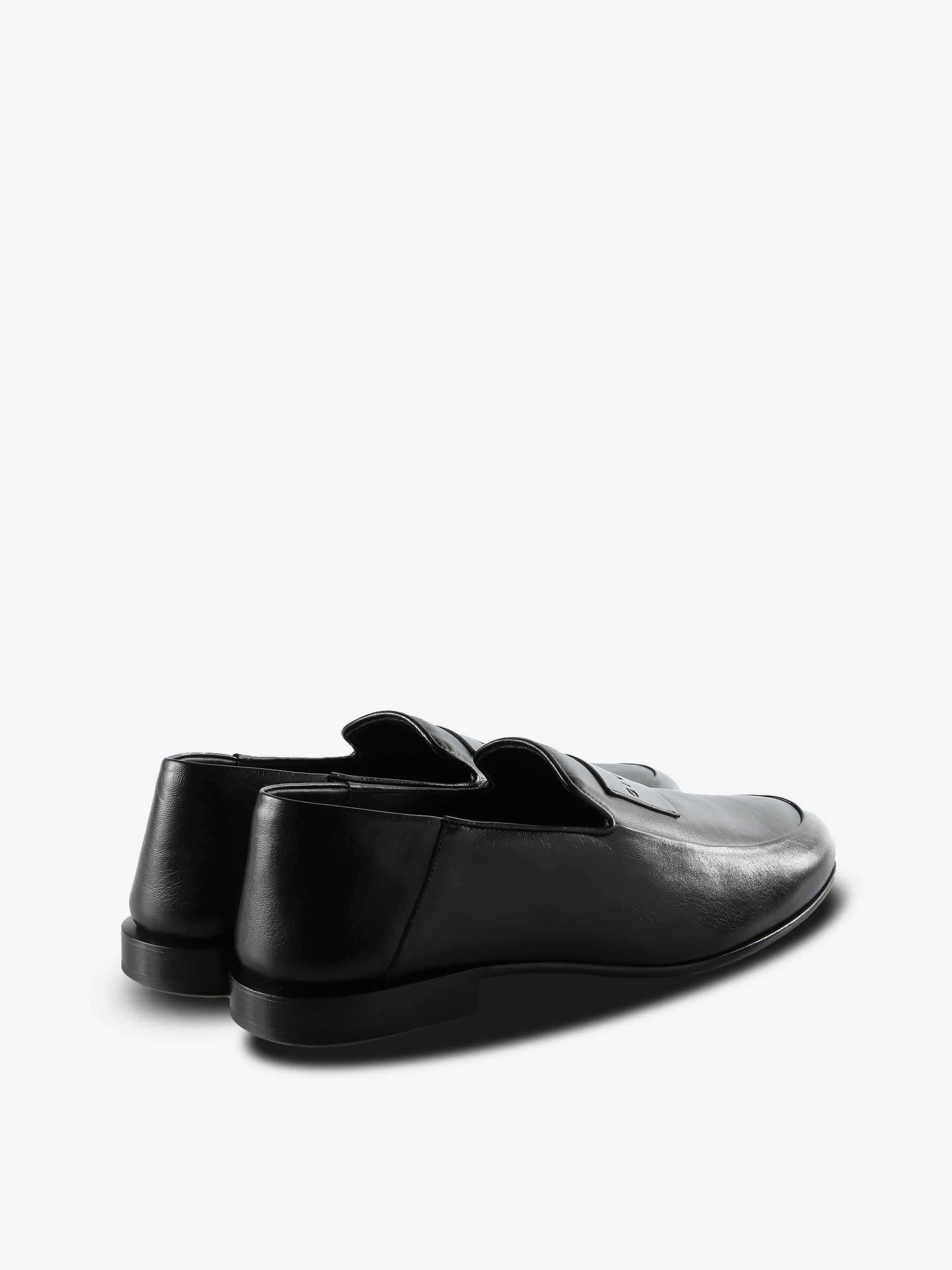 Black loafers,back view