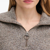 Close up of grey knitwear, showing the texture of cashmere fabric