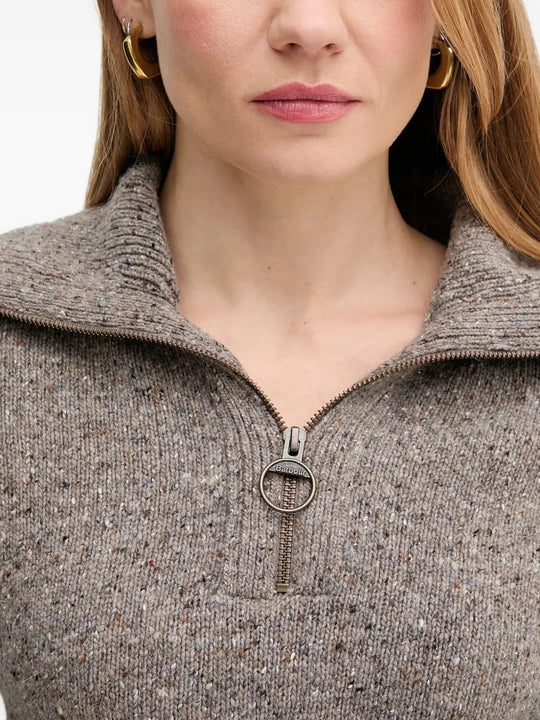 Close up of grey knitwear, showing the texture of cashmere fabric