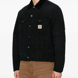 Black jacket worn by a person, showing the jacket fit