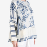 Blue top worn by a person, showing the top fit