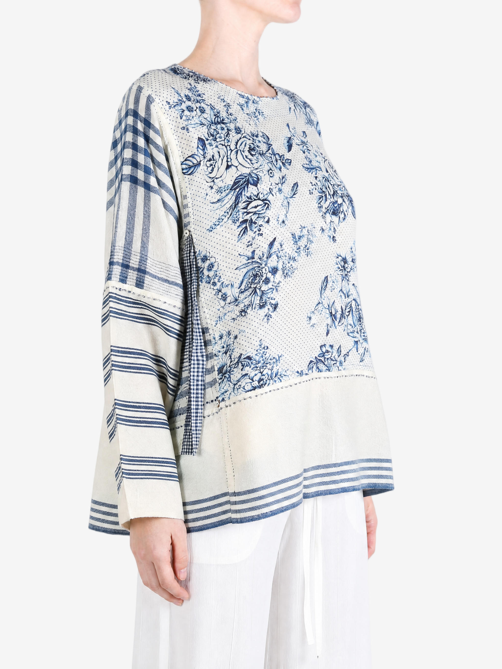 Blue top worn by a person, showing the top fit