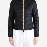 Black jacket worn by a person, showing the jacket fit