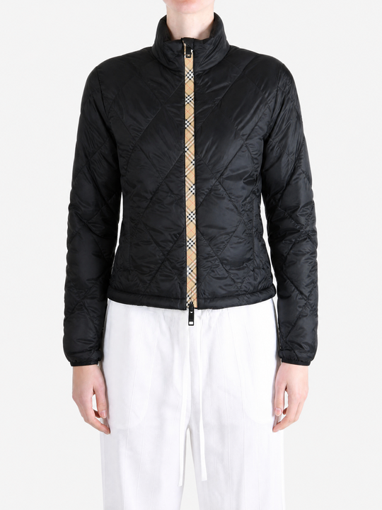 Black jacket worn by a person, showing the jacket fit