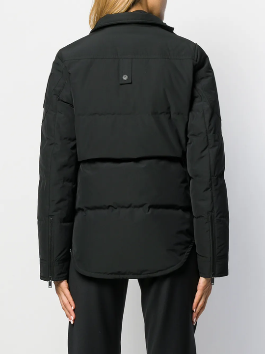 Close up of black jackets, showing texture of the nylon and polyester and feather down fabric