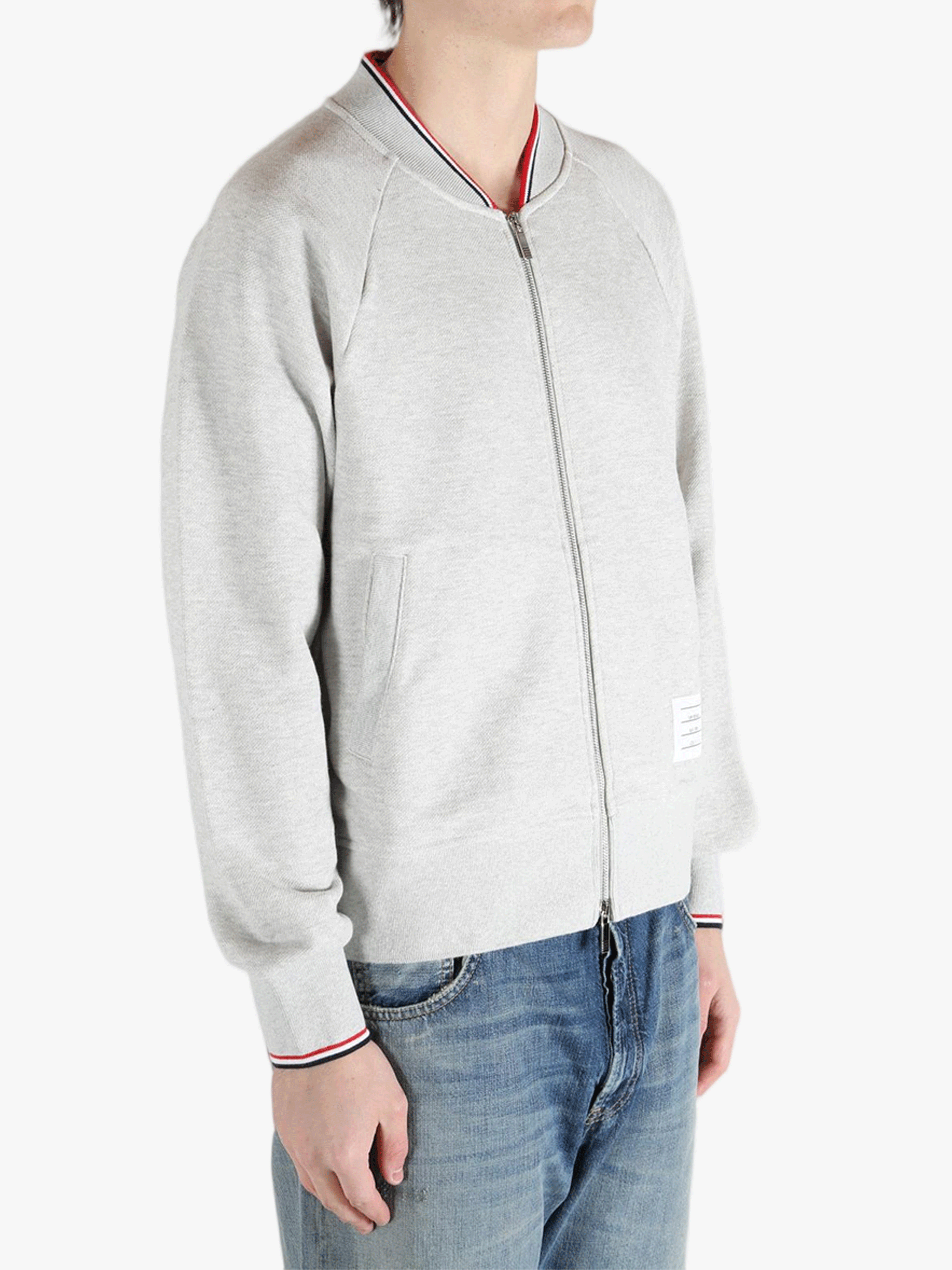 Grey jacket worn by a person, showing the jacket fit