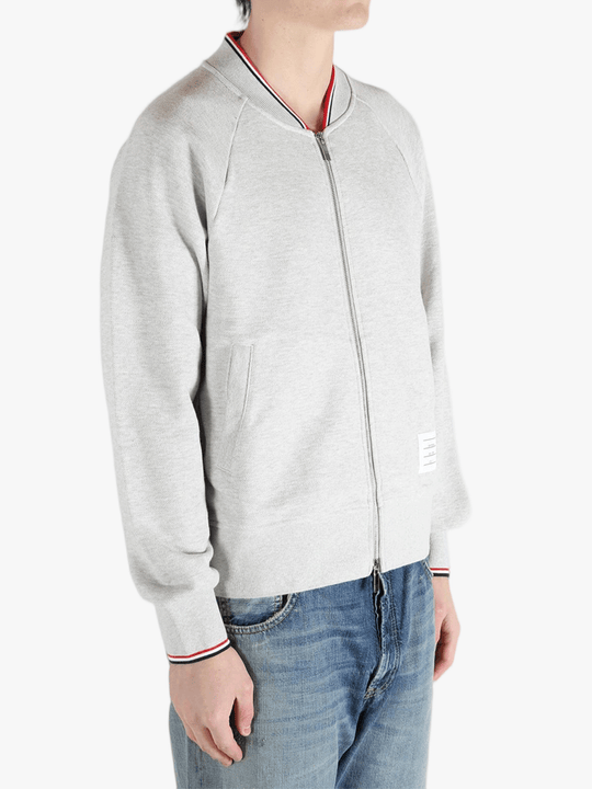 Grey jacket worn by a person, showing the jacket fit