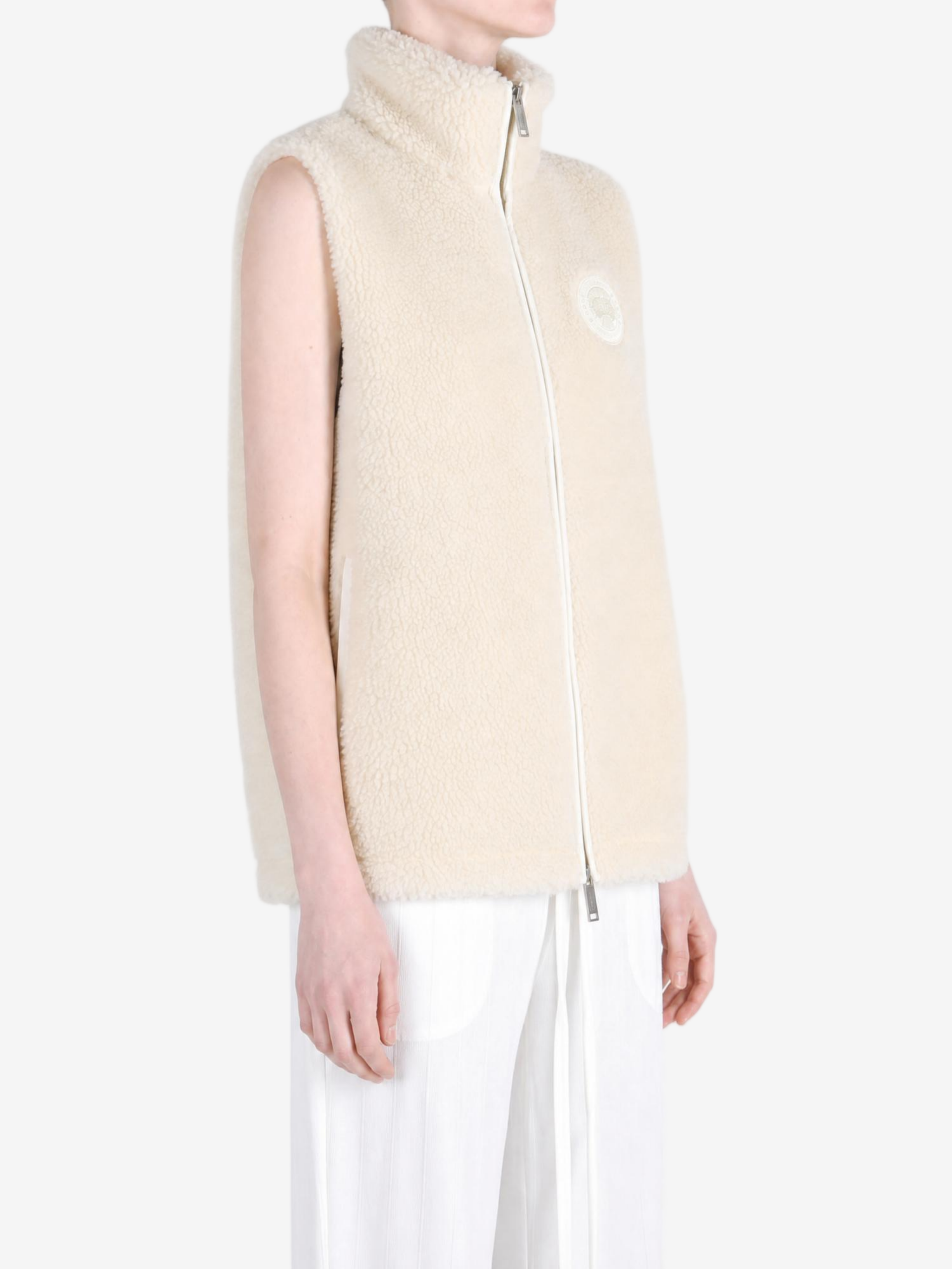 Tan top worn by a person, showing the top fit