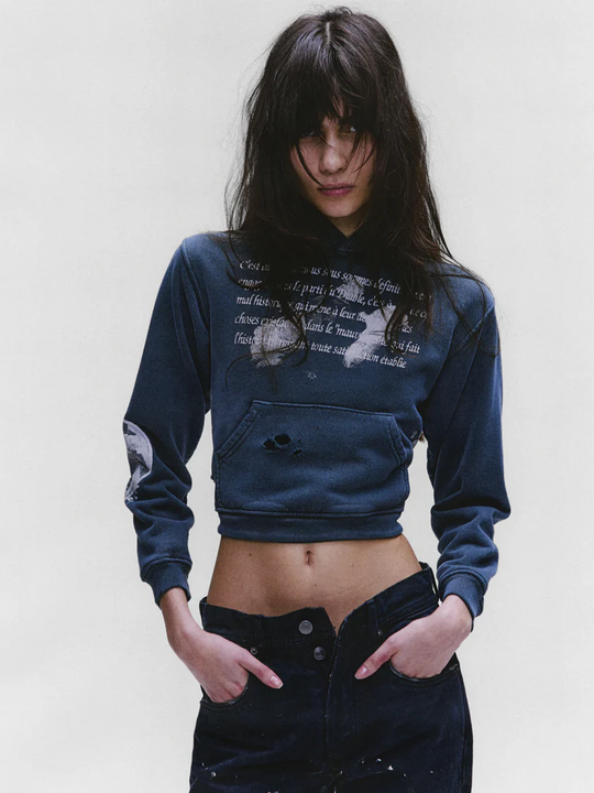 green hoodie,worn by a person,showing the hoodie fit