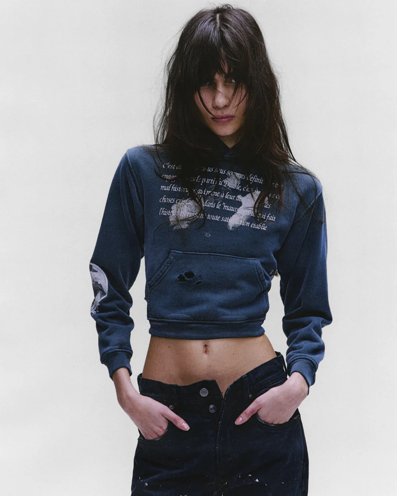 green hoodie,worn by a person,showing the hoodie fit