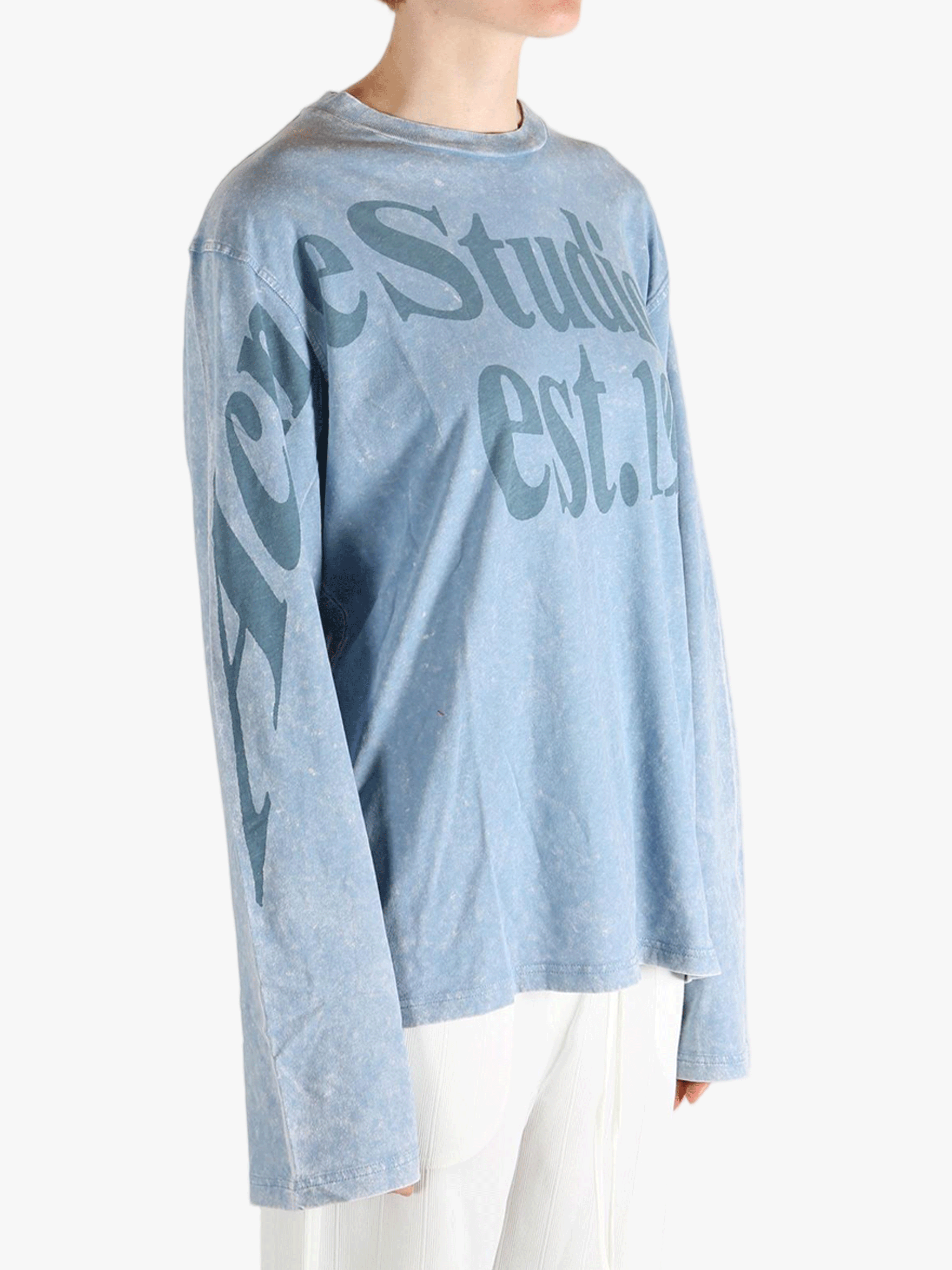 Blue t-shirt worn by a person, showing the t-shirt fit