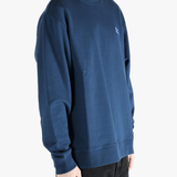 Navy sweater worn by a person, showing the sweater's fit