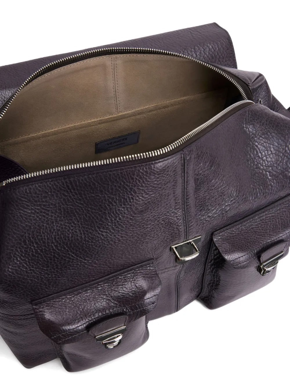 Close up of purple bags, showing texture of the leather fabric