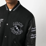 Black jacket worn by a person, showing the jacket fit