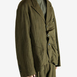 Green blazer worn by a person, showing the blazer's fit