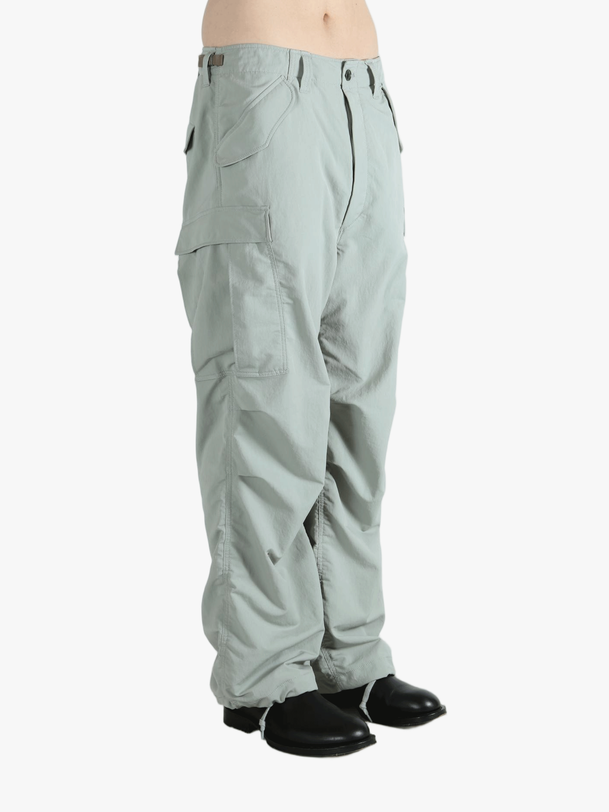 Grey pant worn by a person, showing the pant's fit