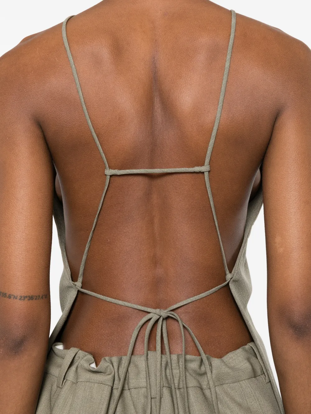Tan shirt worn by a person, showing the shirt fit