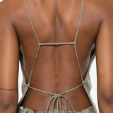 Tan shirt worn by a person, showing the shirt fit