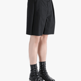 Black short worn by a person, showing the short's fit