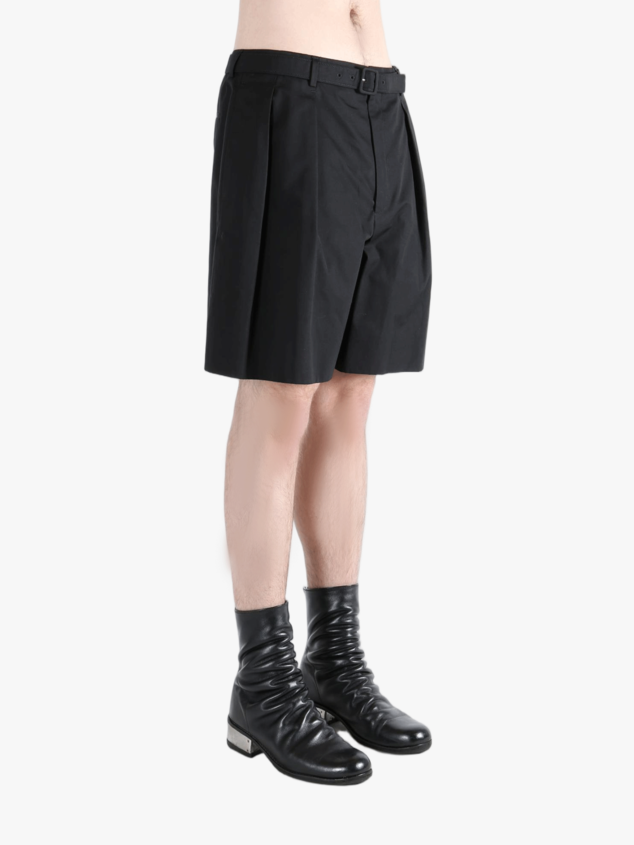 Black short worn by a person, showing the short's fit