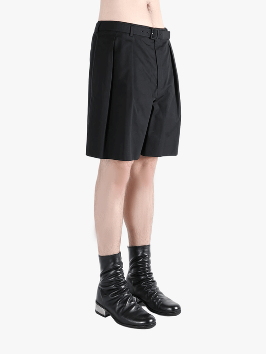 Black short worn by a person, showing the short's fit