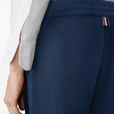 Close up of navy pants, showing texture of the Cotton fabric
