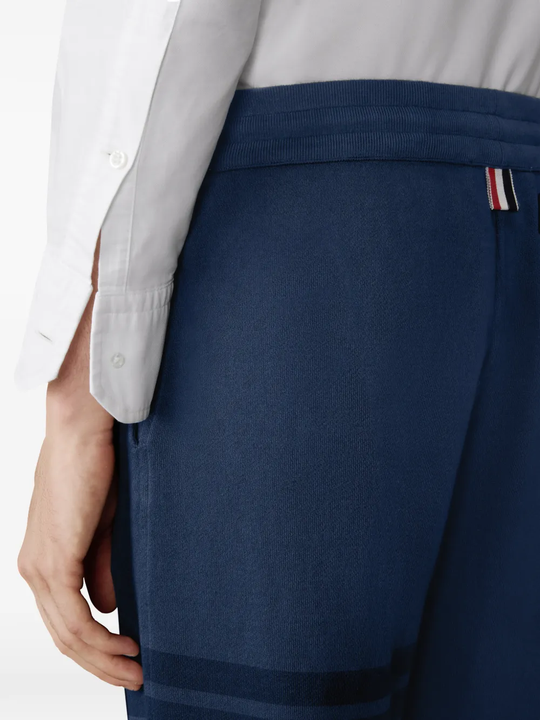 Close up of navy pants, showing texture of the Cotton fabric