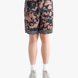 Pink shorts worn by a person, showing the shorts fit 