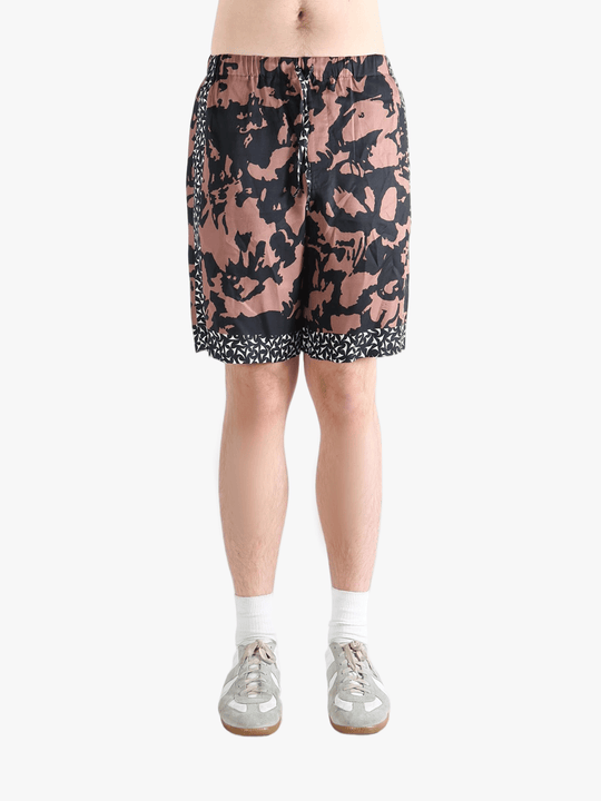 Pink shorts worn by a person, showing the shorts fit 