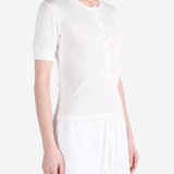 White top worn by a person, showing the top fit