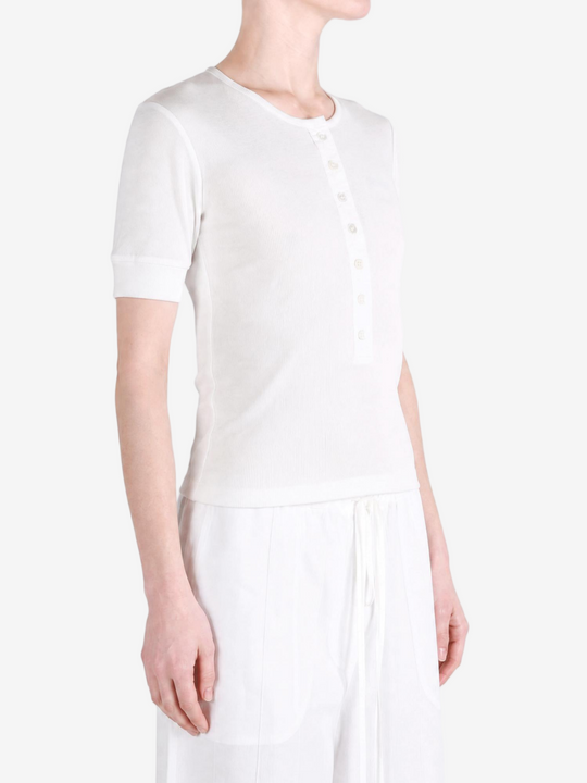 White top worn by a person, showing the top fit