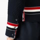 Close up of black knitwear, showing texture of the Fabric fabric