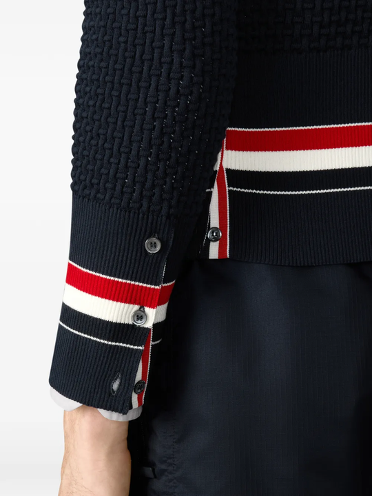 Close up of black knitwear, showing texture of the Fabric fabric