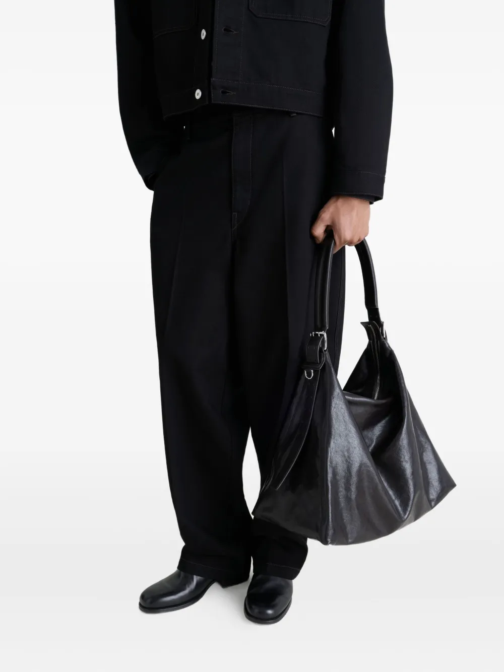 Black bag worn by a person, showing the bag's fit