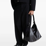 Black bag worn by a person, showing the bag's fit